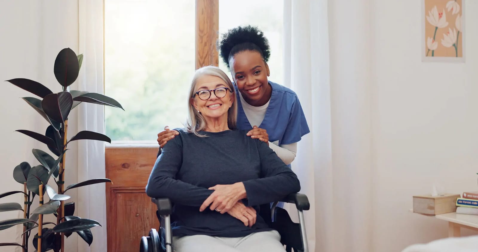 A caregiver with a smiling senior at home
